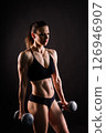 Happy woman do exercise with dumbbell. Smiling female, fitness workout. Healthy lifestyle concept. 126946907