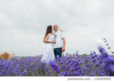 A husband and wife in love in a lavender field A husband and wife in love in a lavender field 126946991