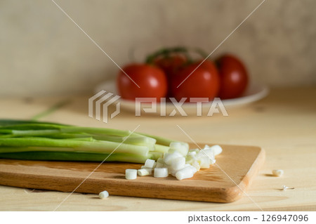 Leaf onion on the board appears fresh and rich Leaf onion on the board appears fresh and rich 126947096
