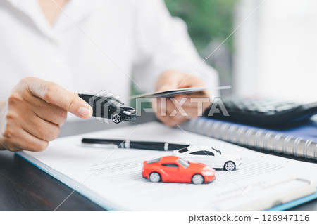 Businesswoman hand stamp approve on financial business approval document paper. Man hand accept permit contract agreement. Broker manager sign contract bank guarantee approved stamp application form 126947116