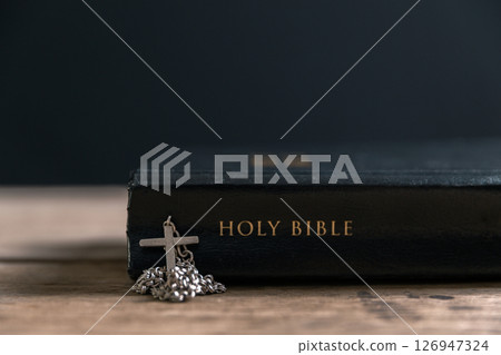 Religious belief concept Close up prayer Christian church service Bible Holy cross Spiritual power Blurred background Desk copy space Heaven God Catholic faith Praise book Jesus worship Gospel symbols Religious belief concept Close up prayer Christian church service Bible Holy cross Spiritual power Blurred background Desk copy space Heaven God Catholic faith Praise book Jesus worship Gospel symbols 126947324