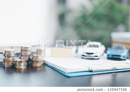 Approved car loan application with car key, rubber stamp and calculator concept. financial document on wooden table. Asset approval purchases to buy car. Ideas for car buying checklist loan tax Approved car loan application with car key, rubber stamp and calculator concept. financial document on wooden table. Asset approval purchases to buy car. Ideas for car buying checklist loan tax 126947386