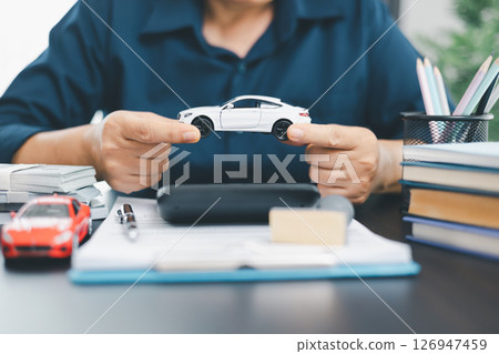 Businesswoman hand stamp approve on financial business approval document paper. Man hand accept permit contract agreement. Broker manager sign contract bank guarantee approved stamp application form 126947459