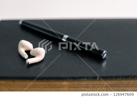 Close-up religious technology headphones pray bible church laptop Jesus Christ Holy Spirit Sunday service spiritual power blur background phone concept heaven belief gospel faith praise worship god 126947609