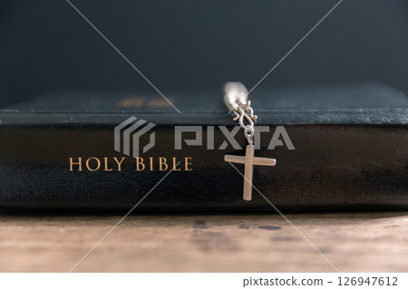 Religious belief concept Close up prayer Christian church service Bible Holy cross Spiritual power Blurred background Desk copy space Heaven God Catholic faith Praise book Jesus worship Gospel symbols Religious belief concept Close up prayer Christian church service Bible Holy cross Spiritual power Blurred background Desk copy space Heaven God Catholic faith Praise book Jesus worship Gospel symbols 126947612