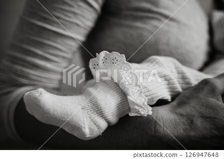 Loving Embrace of Mother and Child in Warm Setting 126947648