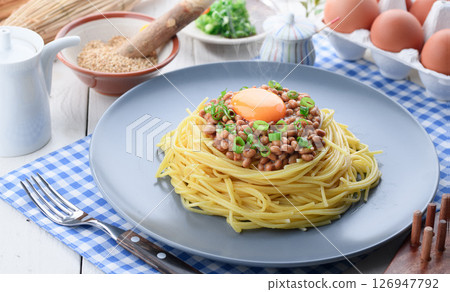 Natto pasta Japanese style spaghetti with raw egg and green onion 126947792