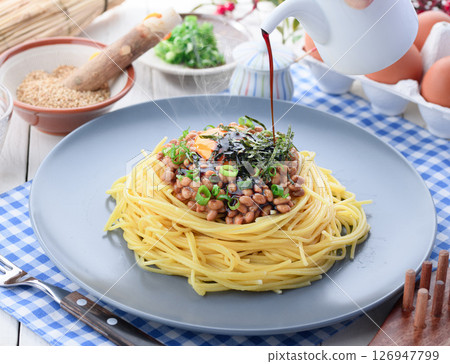 Natto pasta Japanese style spaghetti with raw egg and green onion Natto pasta Japanese style spaghetti with raw egg and green onion 126947799