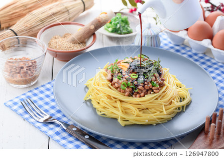 Natto pasta Japanese style spaghetti with raw egg and green onion 126947800