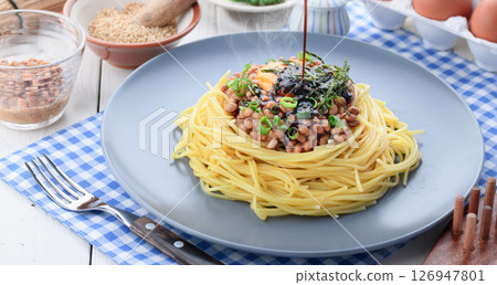 Natto pasta Japanese style spaghetti with raw egg and green onion 126947801