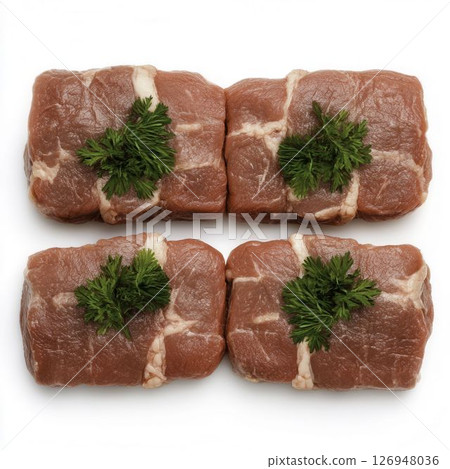 Fresh Raw Beef Cuts with Green Herb Garnish for Culinary Presentation Fresh Raw Beef Cuts with Green Herb Garnish for Culinary Presentation 126948036