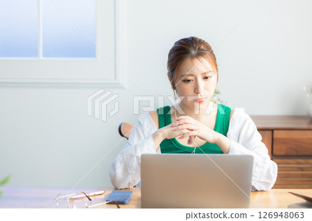 Woman making a video call at home Woman making a video call at home 126948063