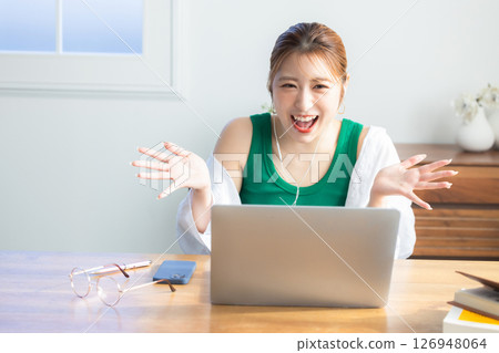 Woman making a video call at home Woman making a video call at home 126948064