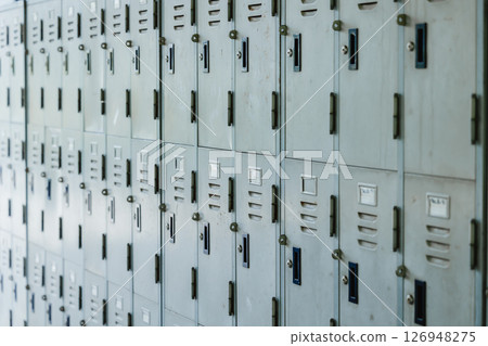 Old metal locker cabinet, Lockers row in factory plant for workers collected personal things Old metal locker cabinet, Lockers row in factory plant for workers collected personal things 126948275