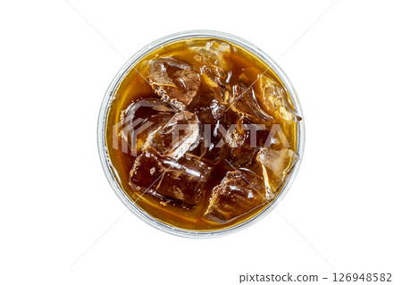 Closeup view of cold brew coffee in a glass isolated over white background. Top view Closeup view of cold brew coffee in a glass isolated over white background. Top view 126948582