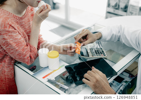 Patient in Drugstore, Pharmacist show many medicine type, Customer select by price and side effect 126948851