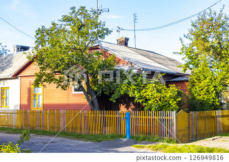 Brest Belarus colorful village streets with wooden huts brick houses . 126949816