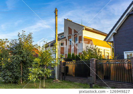Brest Belarus colorful village streets with wooden huts brick houses . 126949827