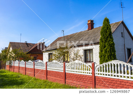 Brest Belarus colorful village streets with wooden huts brick houses . 126949867