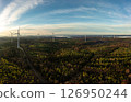 Wind turbine farm inside a forest, drone aerial view at sunrise 126950244