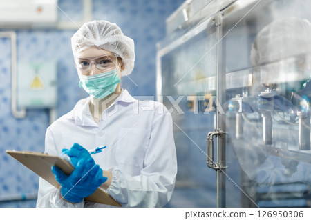 Industry inspector team working, QC staff work checking machine operation for safety and hygiene 126950306