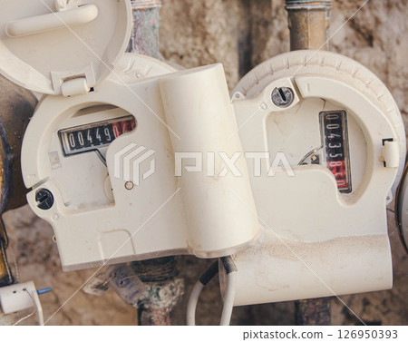 Close-Up of Water Utility Meters on Outdoor Wall Close-Up of Water Utility Meters on Outdoor Wall 126950393