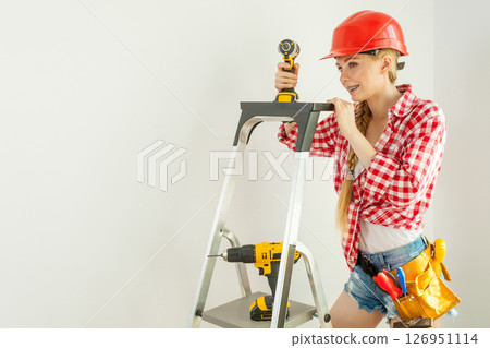 Woman with repairing tools and ladder 126951114