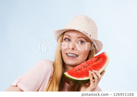 Happy woman holding watermelon Happy woman holding watermelon 126951188