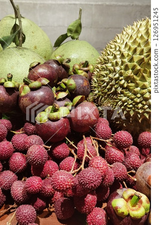 close up of fresh mixed fruits on table 126951245