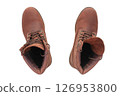 A pair of brown leather boots seen from above on white background. 126953800