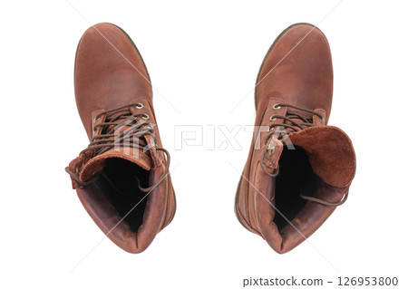 A pair of brown leather boots seen from above on white background. 126953800