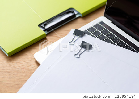 Documents, computer and files clipped together 126954184