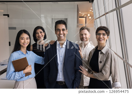 Group of employees posing for photo with company boss Group of employees posing for photo with company boss 126954475
