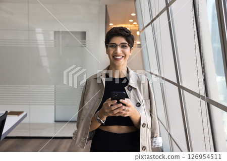 Portrait of Armenian businesswoman posing for camera with modern smartphone 126954511