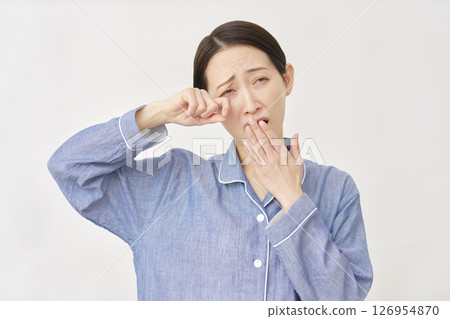 Woman in pajamas, sleep deprivation, white background 126954870