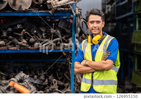 garage mechanic male. portrait engineer man confident, technician in used auto part stock warehouse car junkyard 126955150