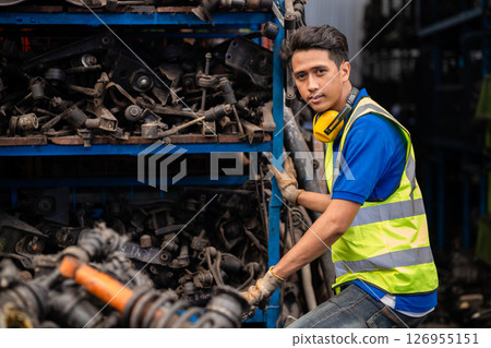 garage mechanic male. portrait engineer man confident, technician in used auto part stock warehouse car junkyard 126955151