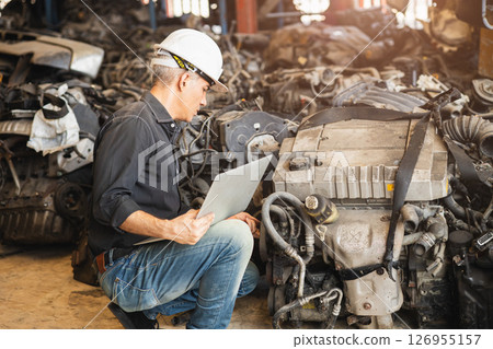adult senior technician engineer finding used car engine block order from customer at scrapyard warehouse recycle area part adult senior technician engineer finding used car engine block order from customer at scrapyard warehouse recycle area part 126955157