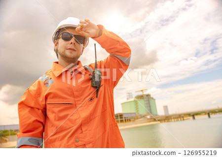 male worker in safety uniform sweating working outdoor in hot summer season, over work, hard work people male worker in safety uniform sweating working outdoor in hot summer season, over work, hard work people 126955219