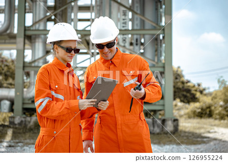 Petroleum refinery service worker, Oil and Gas outdoor pipes and valve inspector, Gas leak checking 126955224