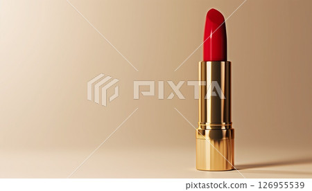 Elegant red lipstick in a gold case on a beige background with copy space, perfect for advertising Elegant red lipstick in a gold case on a beige background with copy space, perfect for advertising 126955539
