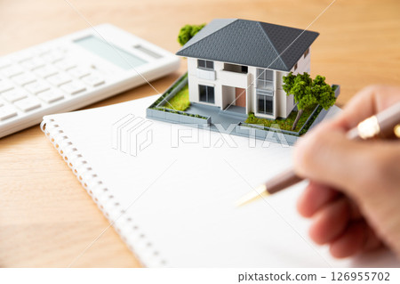 House, notebook, pen and calculator 126955702