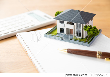 House, notebook, pen and calculator 126955703
