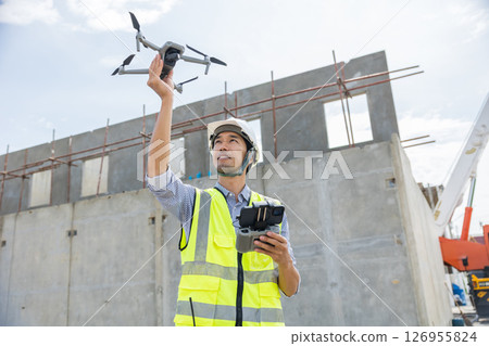 Professional construction engineer builder using UAV Drone to help assist construction site inspect Professional construction engineer builder using UAV Drone to help assist construction site inspect 126955824
