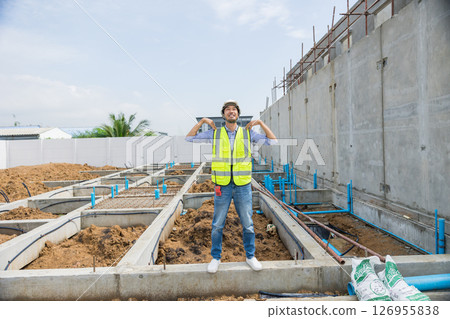 Asian construction engineer, Japanese builder worker male working inspecting footing house building. 126955838