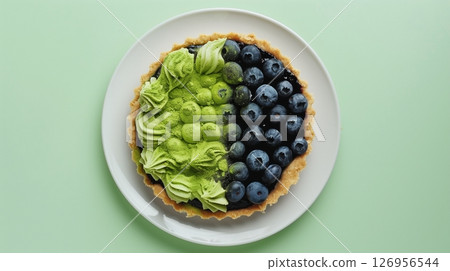 Top of view pie cake topping blueberry and matcha gluten free homemade on solid background 126956544