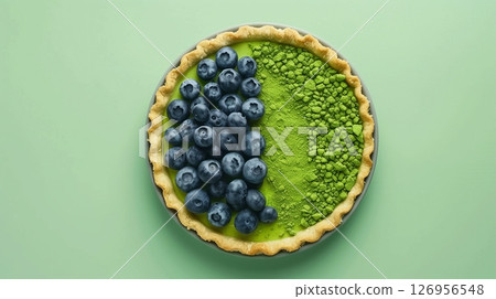 Top of view pie cake topping blueberry and matcha gluten free homemade on solid background 126956548
