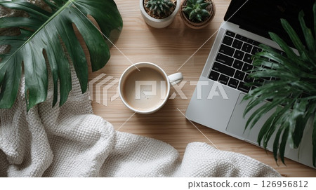 Cozy workspace with coffee and plants 126956812