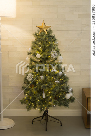 A room with a Christmas tree A room with a Christmas tree 126957996
