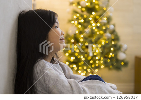 A room with a Christmas tree 126958017